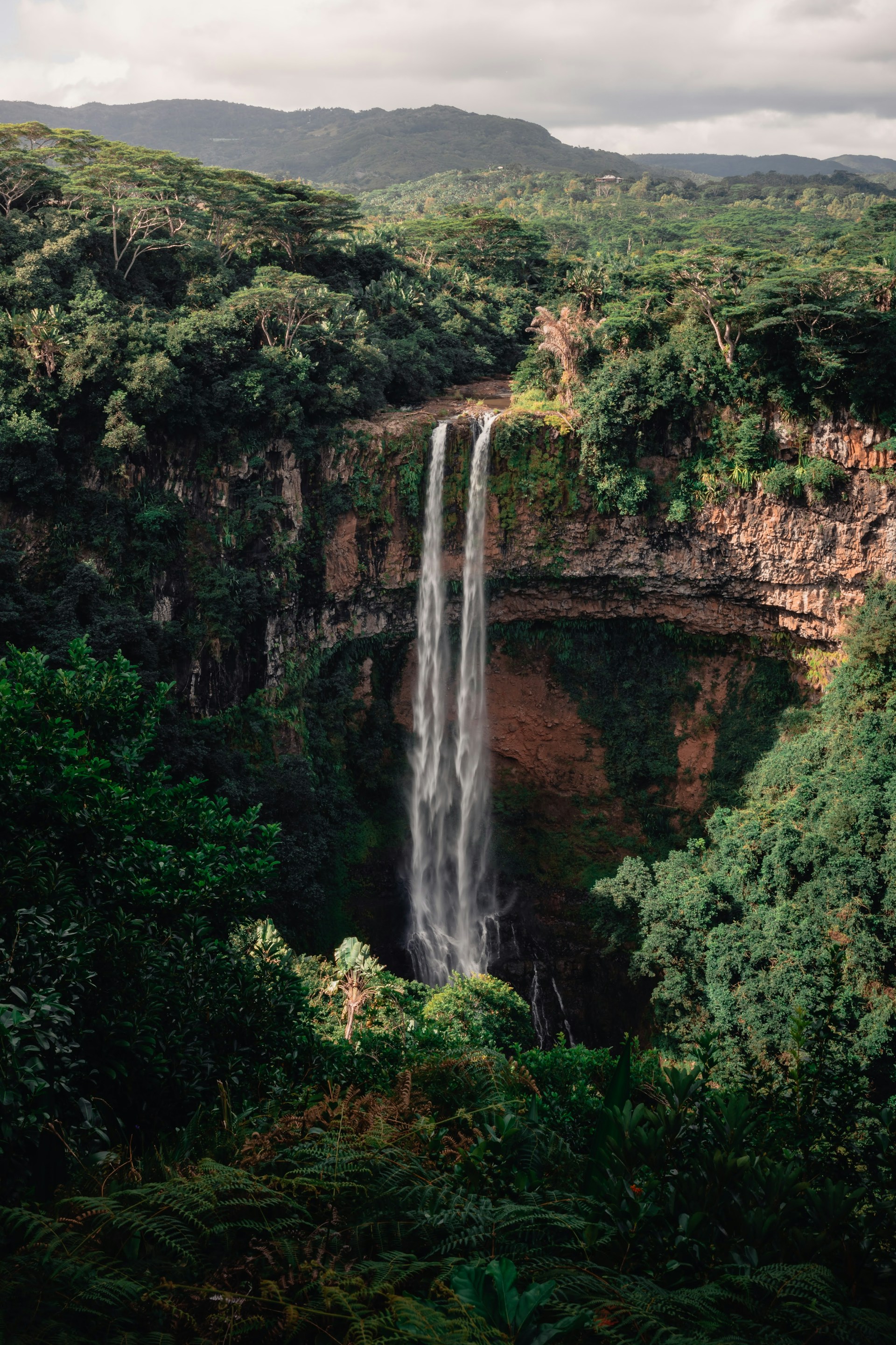 Tropical waterfall in the green landscape of Mauritius