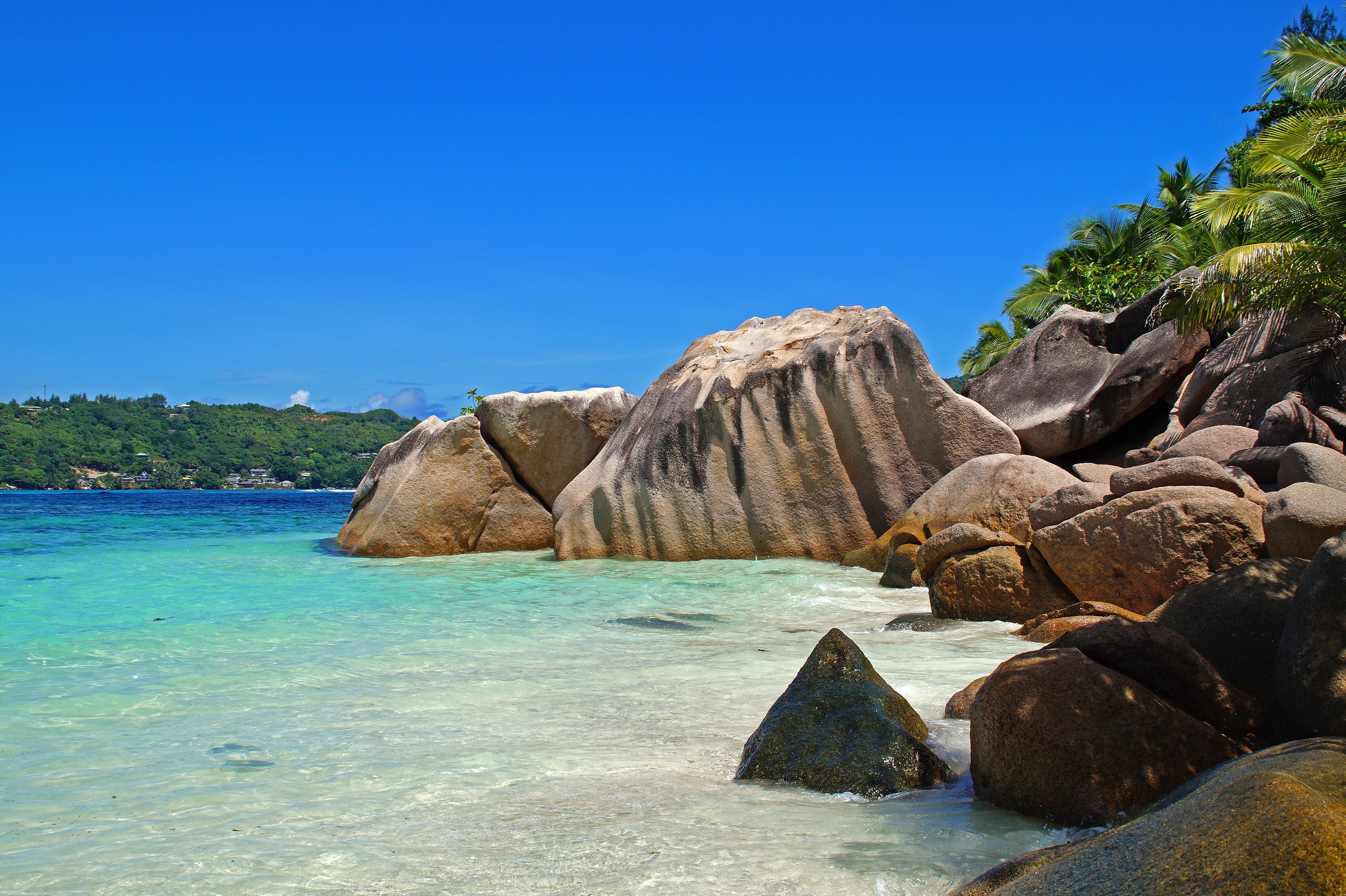 Seychelles turquoise beach and granite rocks for an island extension